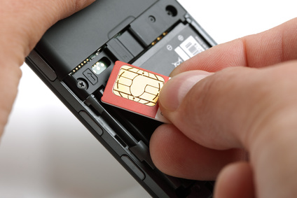 SIM Card Being Inserted Into a Mobile Phone